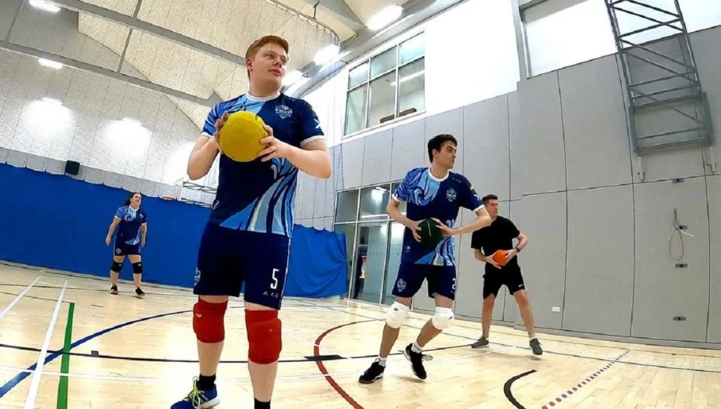 a blue t-shirt boy playing Dodgeball