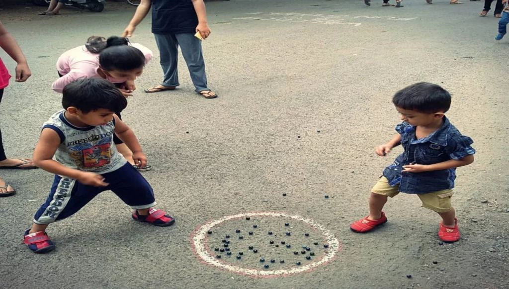two child playing lakhoti